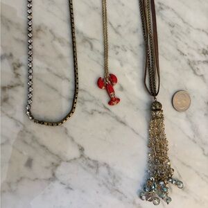 Three long crystal and mixed materials necklaces